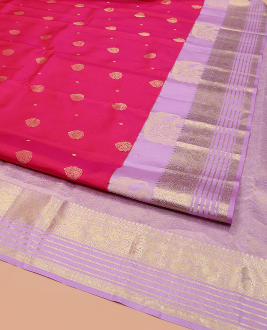 Pink Vasundhara Lite Silk Mix Saree, Adorned with Zari Buttas on Its Body, Complemented by a Contrast Border of Yaanai, Thilakam Mokku, Neli, Mayil, Arumbu Manga, and Kamalam Designs, Grand Ogee-Patterned Pallu, and Paired with a Contrast Blouse