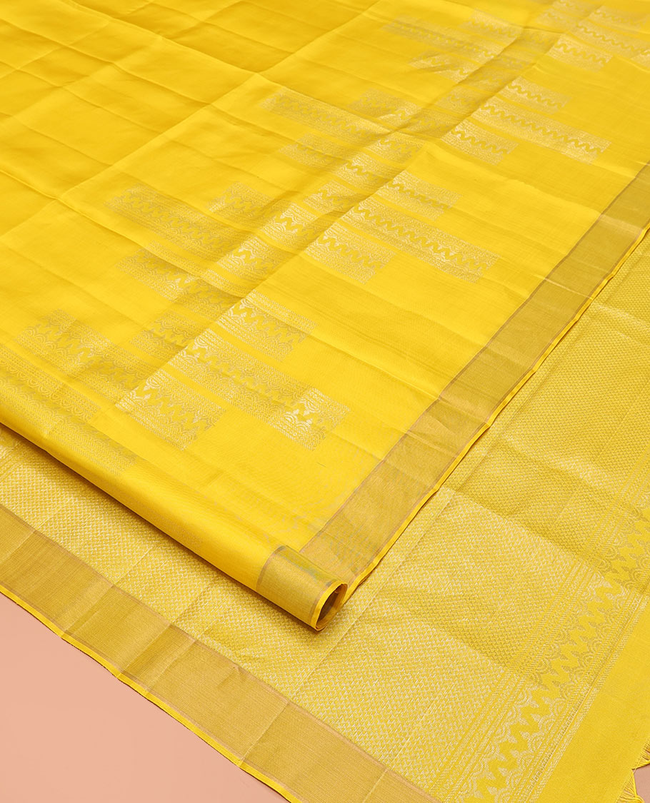 Yellow Mayuri Soft Silk Saree, Subtly Sparkled with Zari Designs All Over Its Body, Highlighted by Zari Border, Pallu of Ara Maadam Designs, and Paired with a Matching Blouse