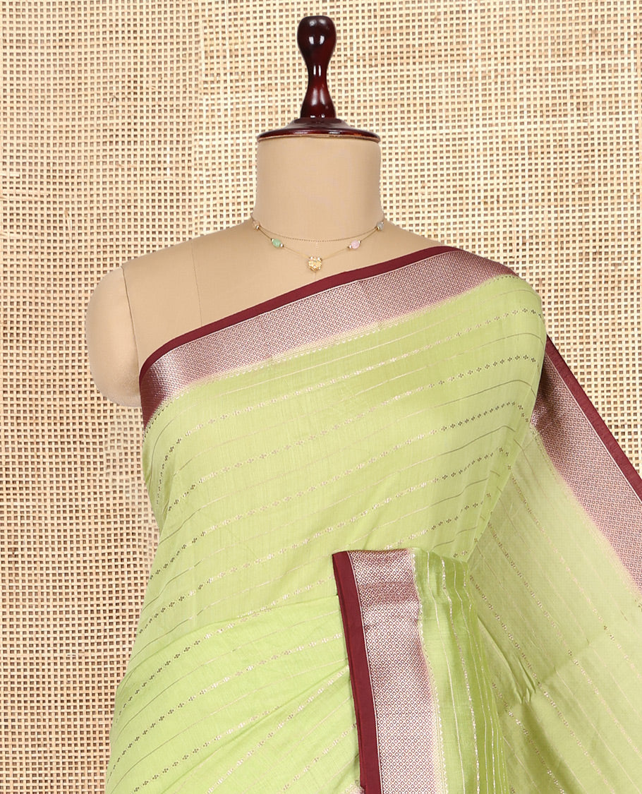 Green Assam Silk Saree, Elevated with Zari Stripes, Complemented by Contrast Zari Border,  Zari Woven Pallu, and Contrast Blouse