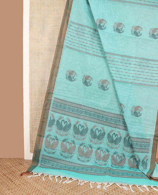 Pale blue buttas and striped coimbatore cotton saree, contrast plain border and pallu of Swan motifs