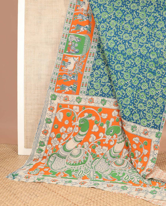 Blue floral machine printed kalamkari cotton saree, contrast human motifs, and pichwai cow printed border, and pallu of peacock print