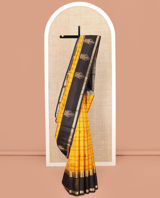 Yellow Kanchipuram Silk Saree Adorned with Checks on Its Body, Complemented by a Contrast Border of Thilakam Mokku, Banaras, Neli, Kamalam, Kili, and Yaanai Designs, Pallu Elegantly Woven with Kamalam Designs, and Paired with a Contrast Blouse