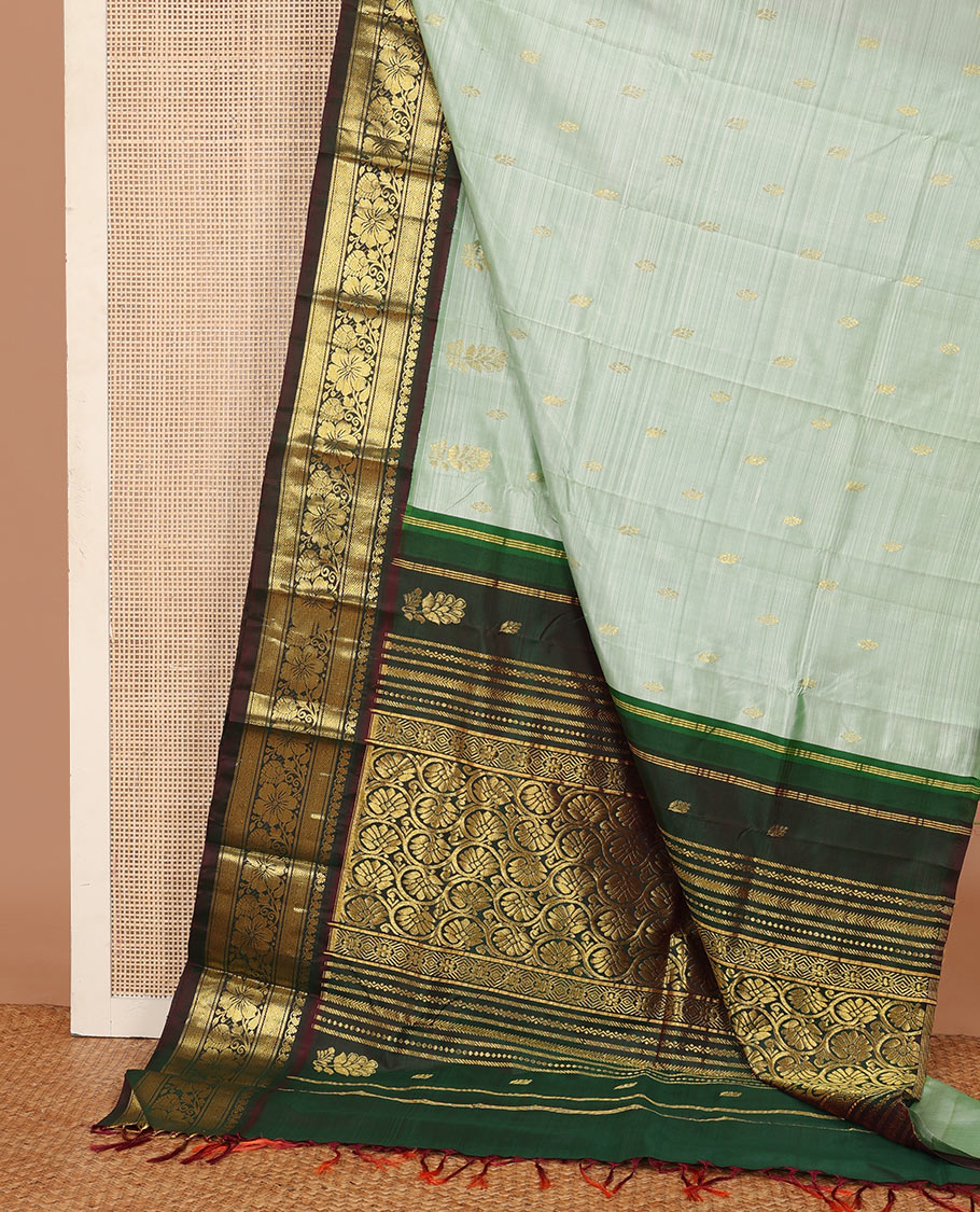 Pastel green zari buttas Kanchipuram silk saree, contrast korvai zari border of manga,diamond, and floral designs, and floral jaal pallu