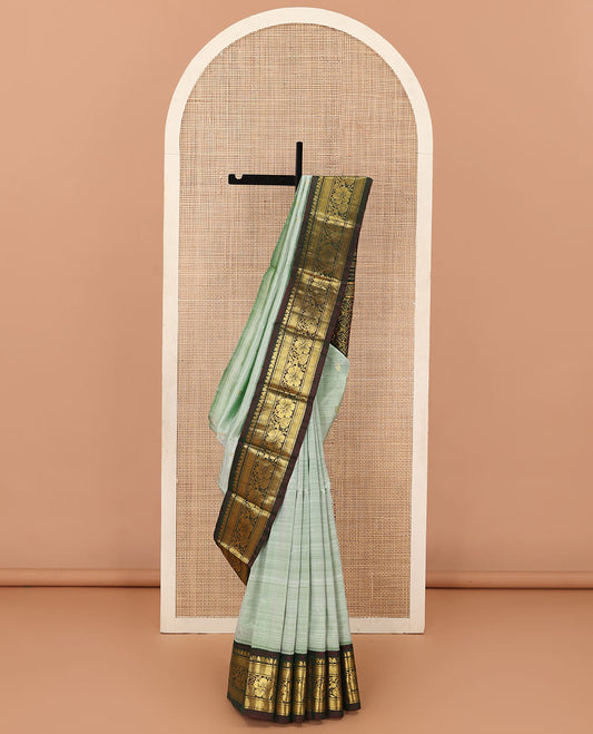 Pastel green zari buttas Kanchipuram silk saree, contrast korvai zari border of manga,diamond, and floral designs, and floral jaal pallu