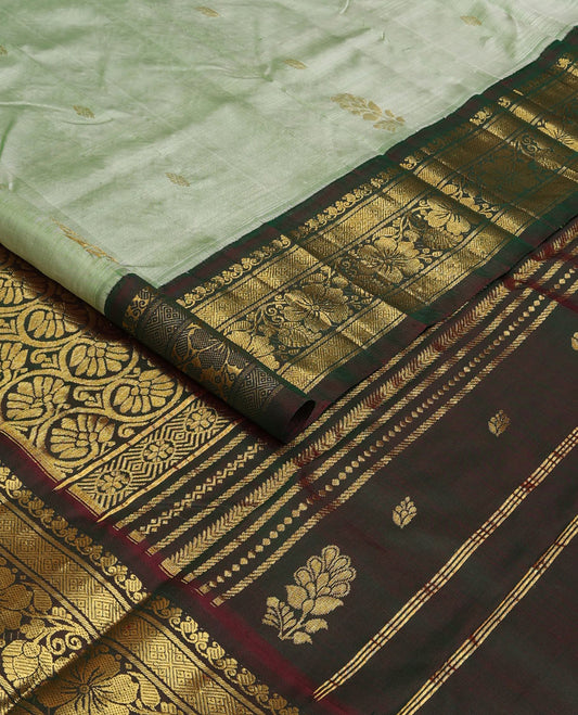 Pastel green zari buttas Kanchipuram silk saree, contrast korvai zari border of manga,diamond, and floral designs, and floral jaal pallu