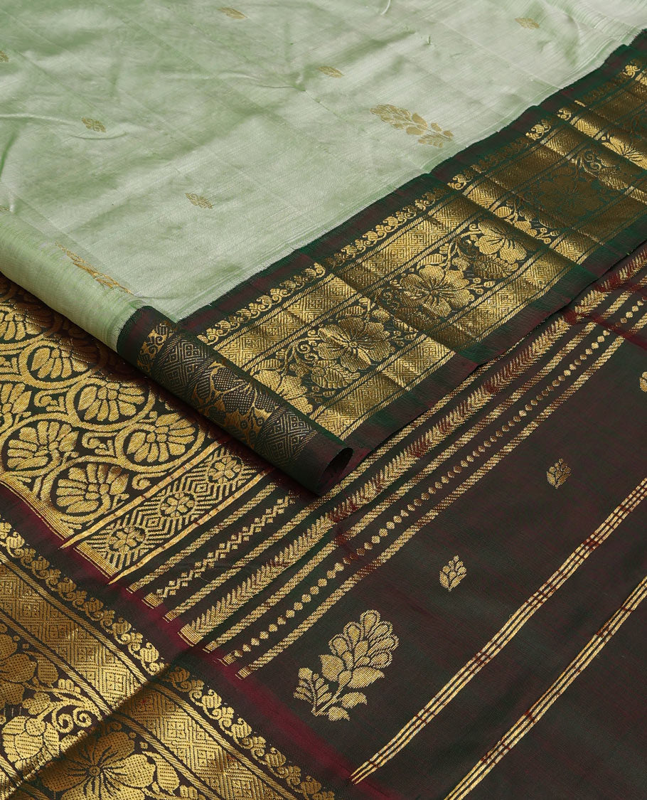 Pastel green zari buttas Kanchipuram silk saree, contrast korvai zari border of manga,diamond, and floral designs, and floral jaal pallu
