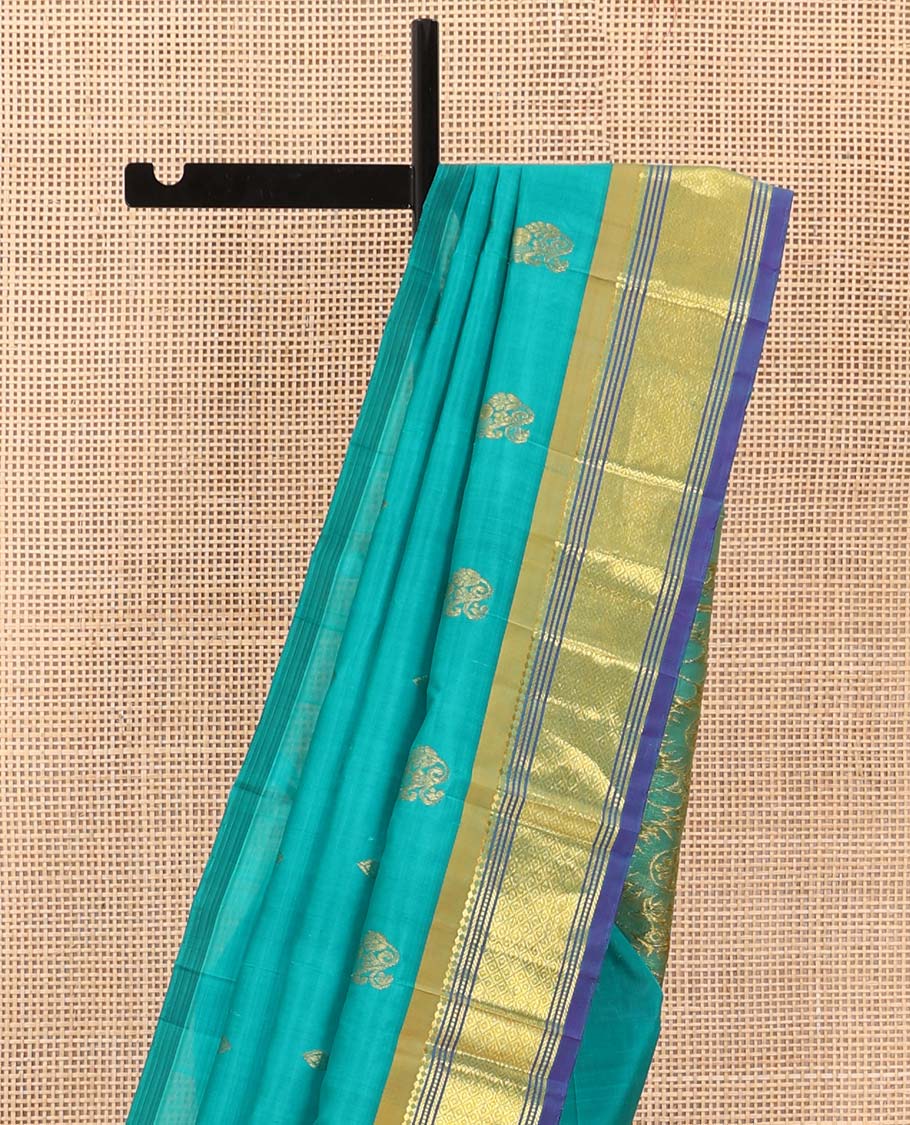 Blue zari buttas Kanchipuram silk saree, contrast border of paneer sombu, banaras, muthu, and mayil kann designs, and floral design pallu