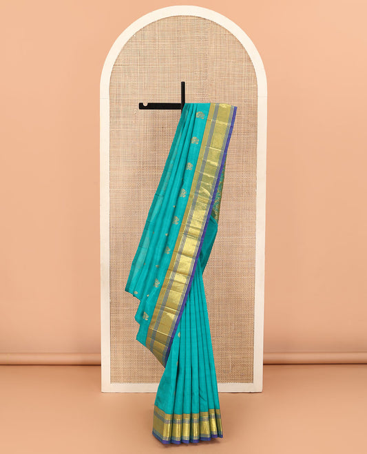 Blue zari buttas Kanchipuram silk saree, contrast border of paneer sombu, banaras, muthu, and mayil kann designs, and floral design pallu