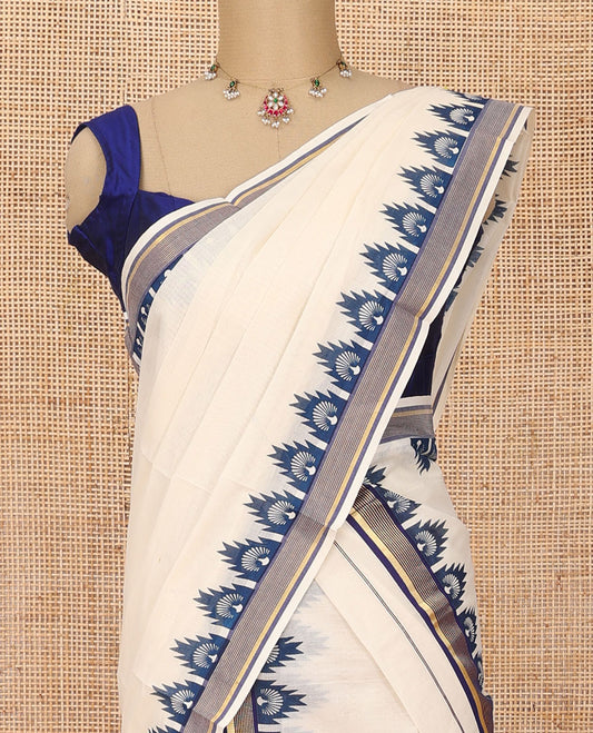 Cream plain Kerala mundu set with contrast blue peacock butta enclosed temple border