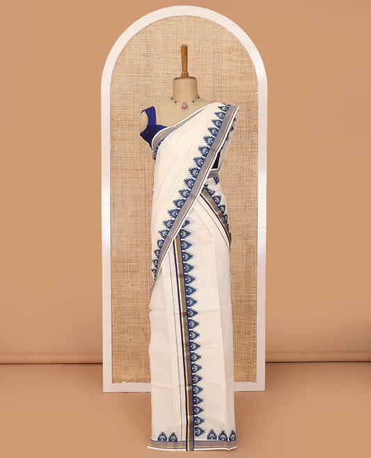 Cream plain Kerala mundu set with contrast blue peacock butta enclosed temple border