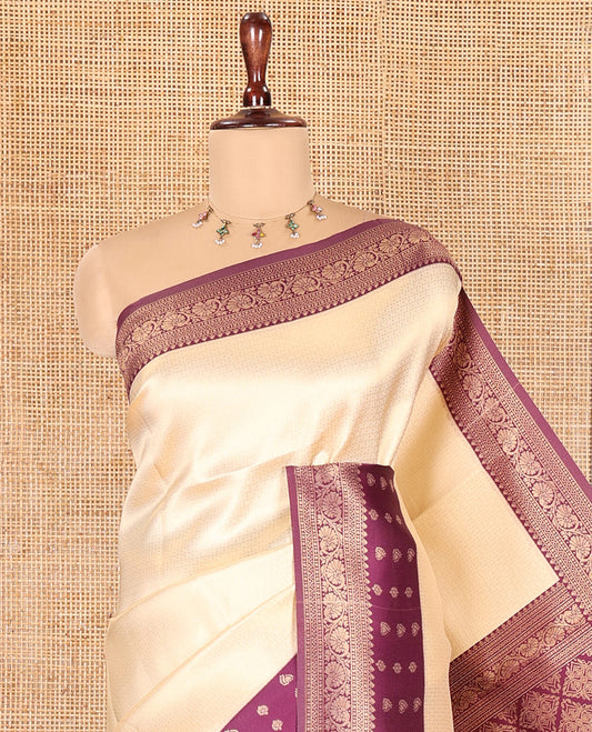 Cream-Purple Embossed Art Kanchi Silk Saree, a Contrast Traditional Zari Border, Grand Jaal Pallu, and a Contrast Blouse