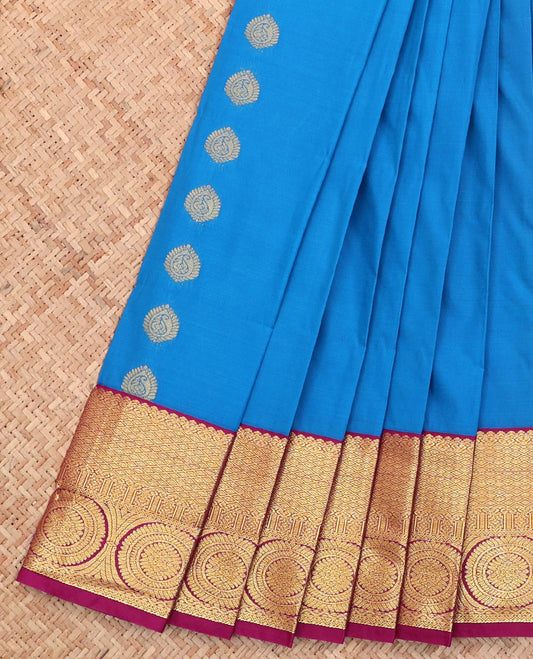 Blue Budget Silk Saree, Adorned with Zari Buttas All Over Its Body, Complemented by a Contrast Traditional Zari  Design Border of Chakram Designs, Grand Jaal Pallu, and Paired with a Contrast Blouse