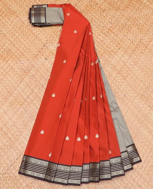 Orange thilakam motifs budget silk saree, contrast traditional zari design border, and jaal pallu