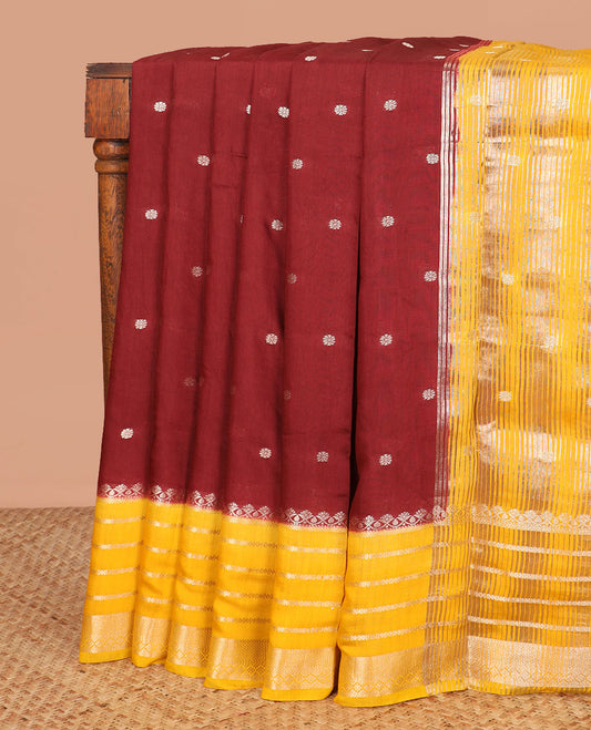 Brown floral buttas assam silk saree, contrast traditional zari border, and pallu of stripes and zari buttas