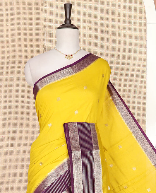 Yellow peacock buttas assam silk saree, contrast traditional zari border, and pallu of zari design