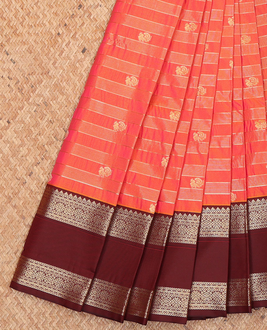 Orange Budget Silk Saree, Bedecked with Zari Stripes and Peacock Buttas on Its Body, Complemented by Contrast Traditional Zari Design Rettai Pettu Border, Opulently Embellished Pallu, and Paired with a Contrast Blouse