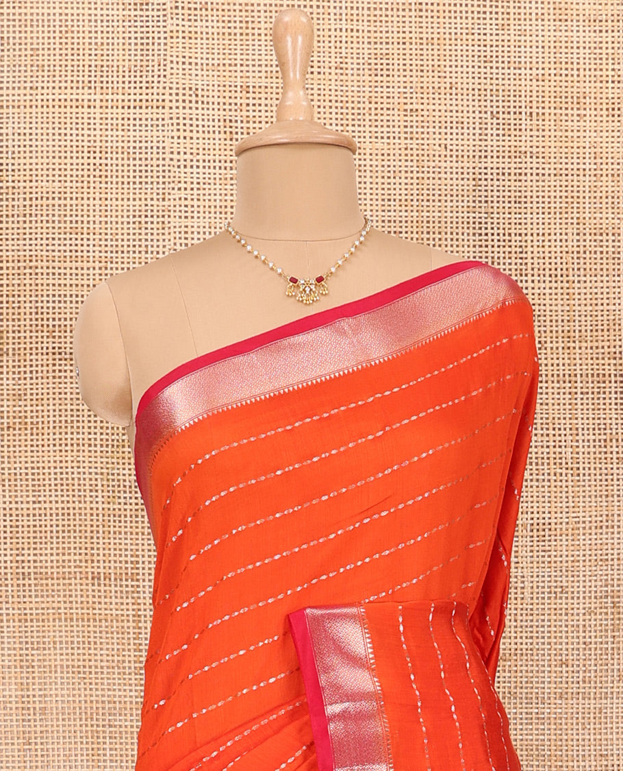 Dark Orange Assam Silk Saree Elevated with All-Over Buttas, Complemented with a Contrast Traditional Zari  Border, Zari-Striped Pallu, and Paired with a Contrast Blouse