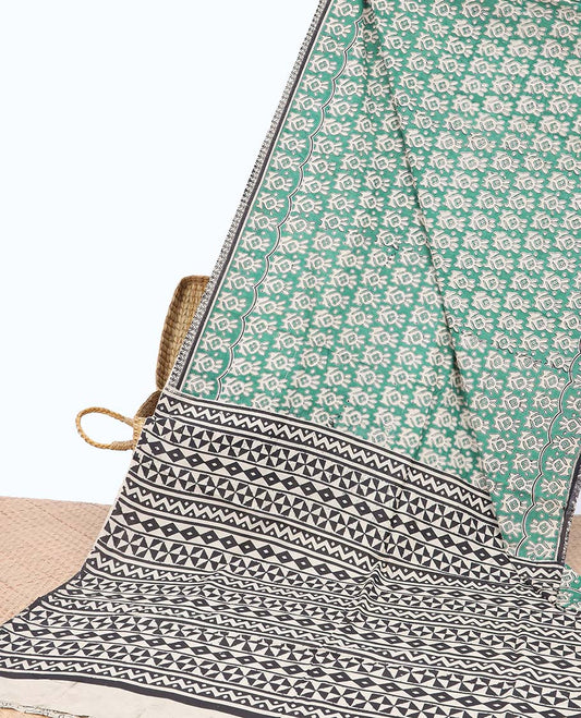 Green batik floral machine-printed kalamkari cotton saree with contrast batik border & geometric design pallu