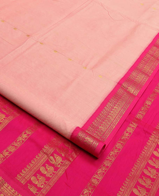 Peach buttas nine-yard cotton saree, contrast traditional zari border, and pallu steeped with traditional motifs