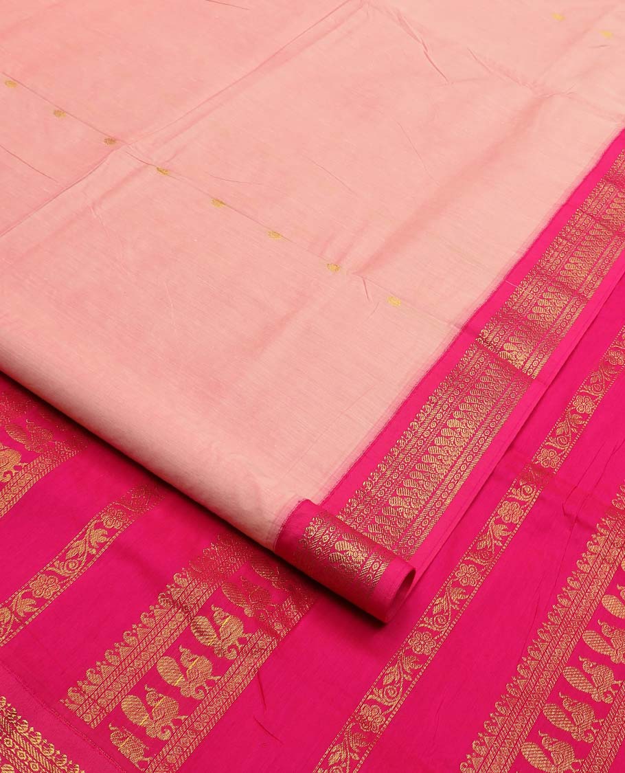 Peach buttas nine-yard cotton saree, contrast traditional zari border, and pallu steeped with traditional motifs