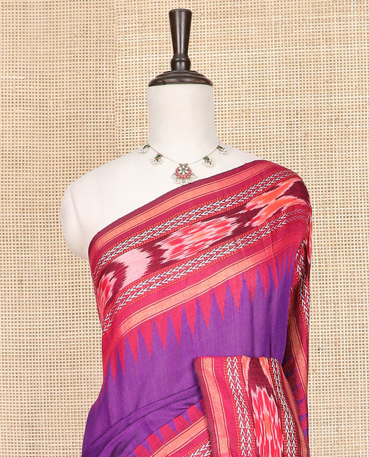 Purple Plain Dupion Silk Saree, Spotlighted with a Contrast Temple Border of Geometric Patterns and Ikkat Weave, Pallu Depicting Floral Ikkat Designs, and Paired with a Contrast Blouse