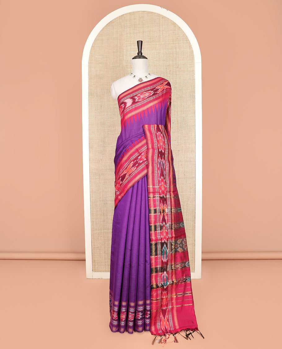 Purple Plain Dupion Silk Saree, Spotlighted with a Contrast Temple Border of Geometric Patterns and Ikkat Weave, Pallu Depicting Floral Ikkat Designs, and Paired with a Contrast Blouse