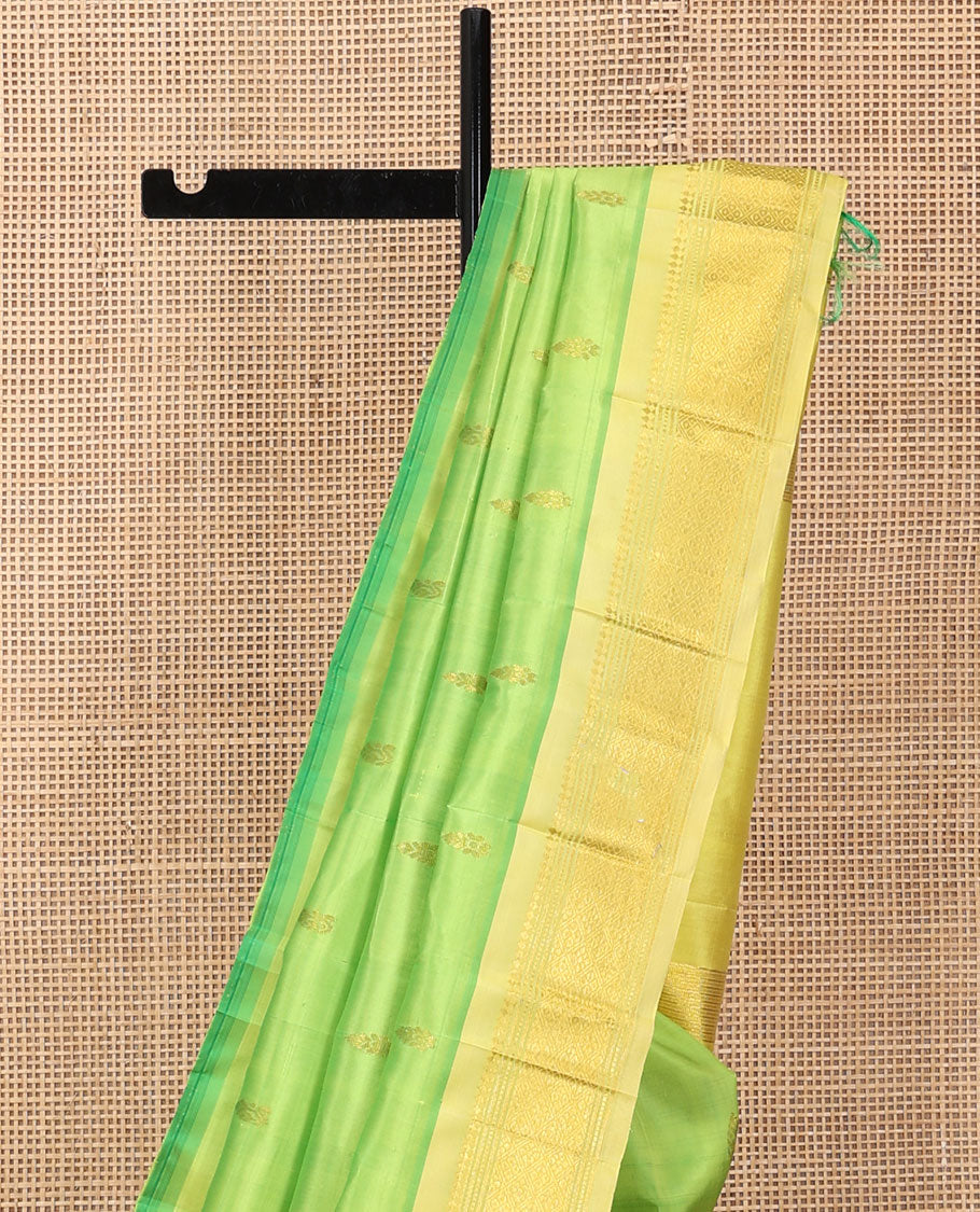 Green Kanchipuram Silk Saree, Woven with Zari Buttas, a Contrast One-Sided Border of Panner Sombu, Banaras, Muthu, and Jaal Designs, a Zari Design Pallu, and No Blouse