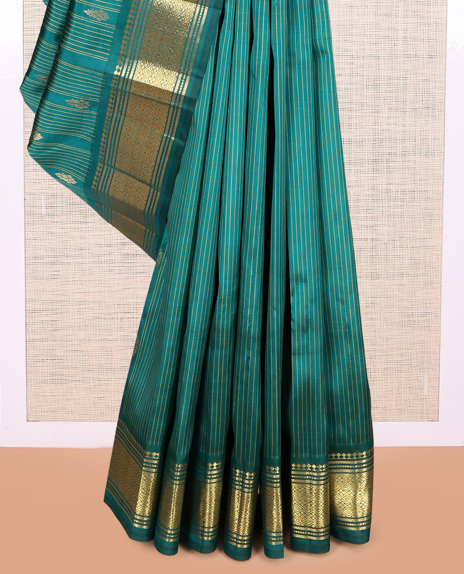 Green Kanchipuram Silk Saree, Subtly Sparkled with Stripes and Buttas, a Zari One-sided Border of Paneer Sombu, Banaras, Muthu, and Jaal Designs, Zari Design Pallu, and No Blouse