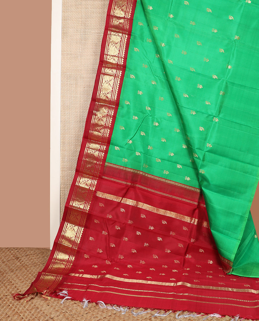 Green zari buttas Kanchipuram silk saree, contrast korvai one-sided zari border, and zari design pallu