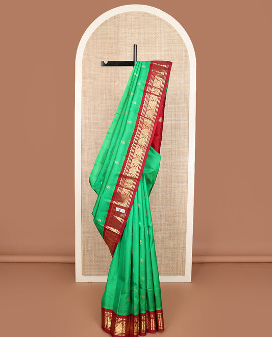 Green zari buttas Kanchipuram silk saree, contrast korvai one-sided zari border, and zari design pallu