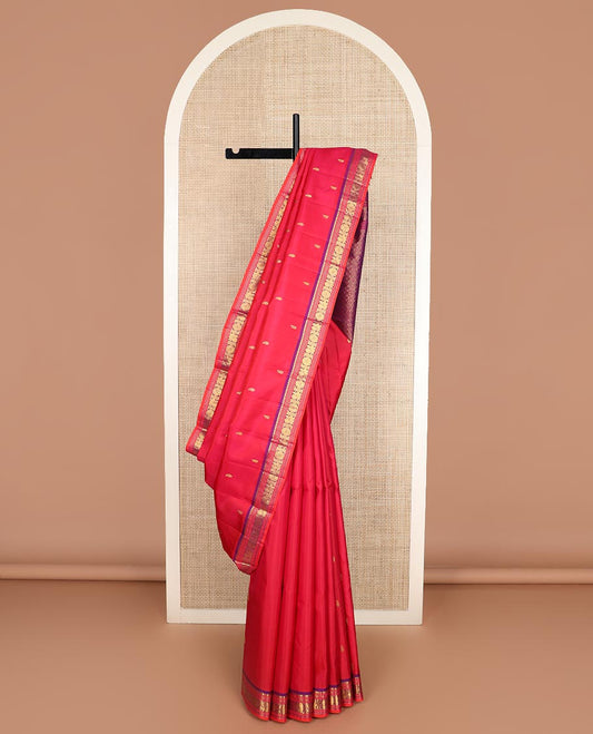 Red zari buttas Kanchipuram silk saree, contrast border of manga, neli, annam and chakram designs, and poun and diamond motifs steeped pallu