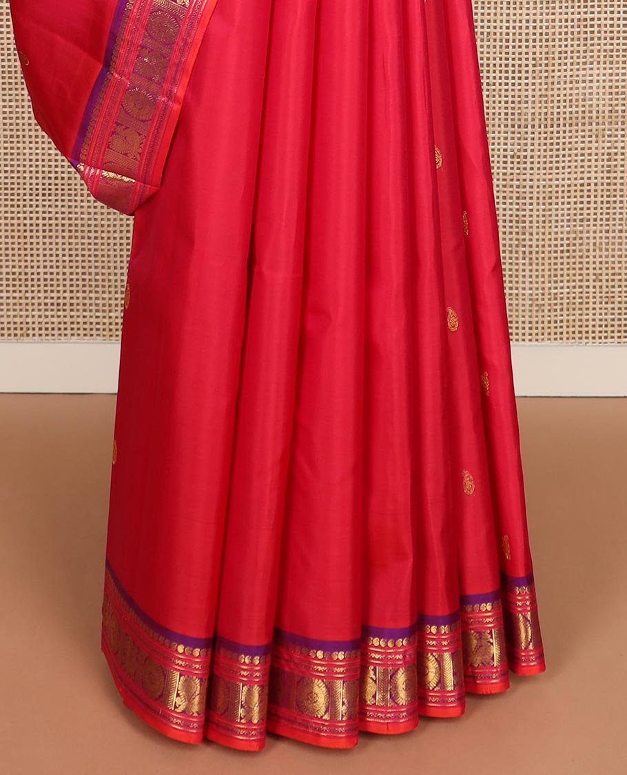 Red zari buttas Kanchipuram silk saree, contrast border of manga, neli, annam and chakram designs, and poun and diamond motifs steeped pallu