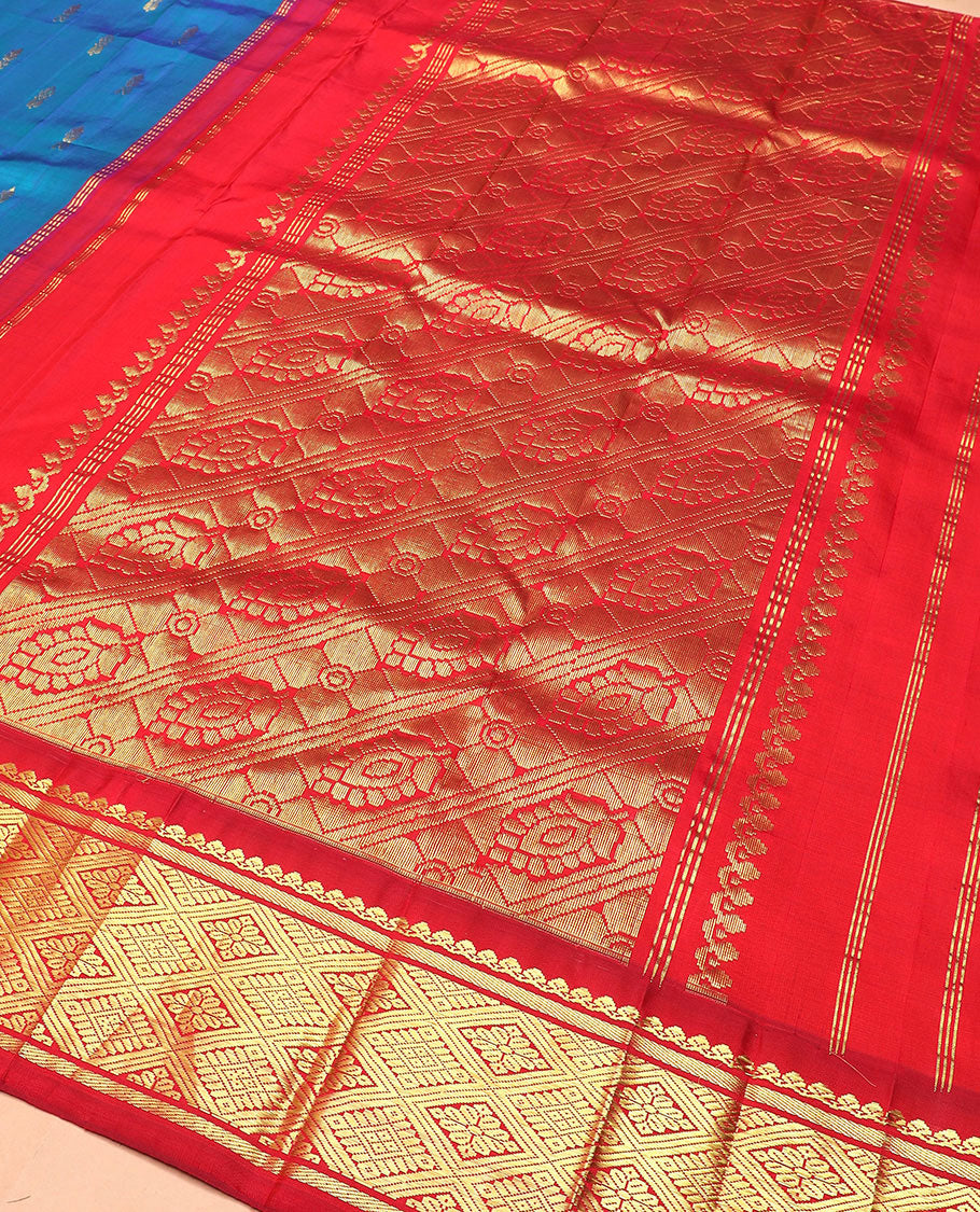 Blue zari buttas Kanchipuram silk saree, contrast korvai border of thilakam mokku, banaras, and jaal designs, and intricate pallu