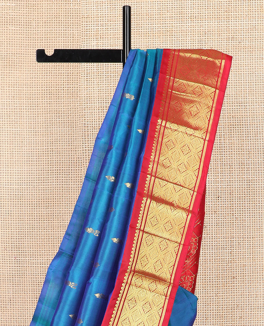 Blue zari buttas Kanchipuram silk saree, contrast korvai border of thilakam mokku, banaras, and jaal designs, and intricate pallu