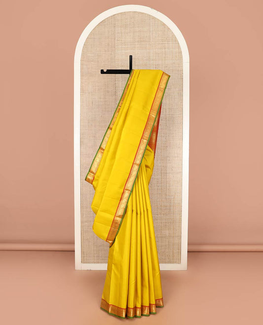 Yellow Plain Kanchipuram Silk Saree, Complemented by Contrast Border of Rekku, Neli, and Yaanai Designs, Pallu of Zari Designs, and Paired with a Contrast Blouse