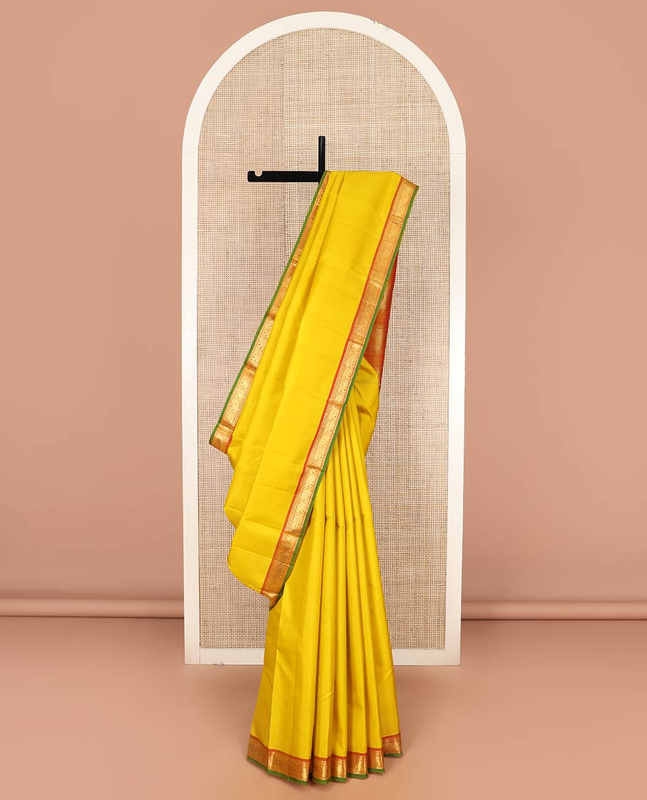 Yellow Plain Kanchipuram Silk Saree, Complemented by Contrast Border of Rekku, Neli, and Yaanai Designs, Pallu of Zari Designs, and Paired with a Contrast Blouse