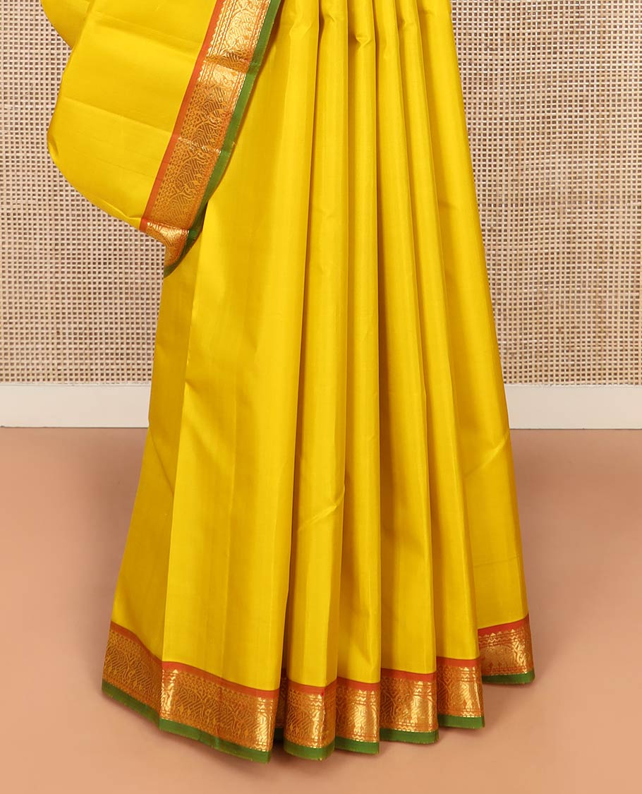 Yellow Plain Kanchipuram Silk Saree, Complemented by Contrast Border of Rekku, Neli, and Yaanai Designs, Pallu of Zari Designs, and Paired with a Contrast Blouse