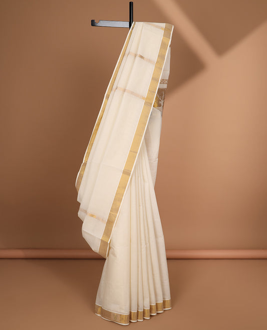 Cream kerala saree with zari designs, zari border & pallu of deer designs