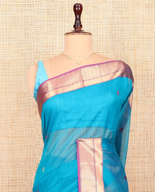 Blue Maheshwari Cotton Saree, Dazzled with Flower Buttas All Over Its Body, Complemented by a Contrast Zari Traditional Design Border, Pallu Steeped with Flower Buttas, and Paired with a Contrast Blouse