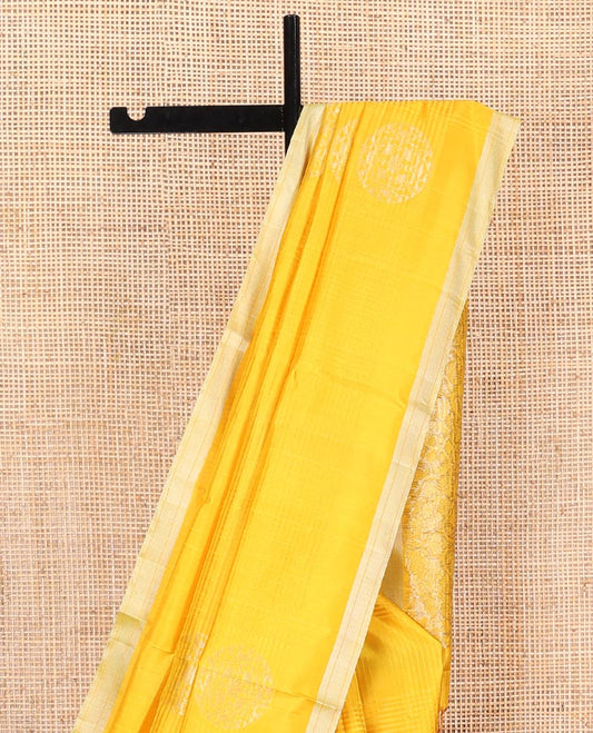 Yellow Mayuri Soft Silk Saree, Bedecked with Stripes and Buttas on Its Body, Subtle Zari Piping Border, Pallu Features Floral Jaal Designs, and Paired with a Matching Blouse