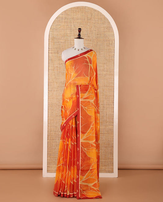 Orange digital print chiffon shimmer saree with lace border & self pallu along with printed blouse