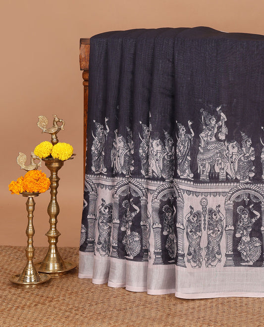 Black half-and-half kalamkari-style human figurines printed linen cotton saree, contrast bavanji border & peacock pallu