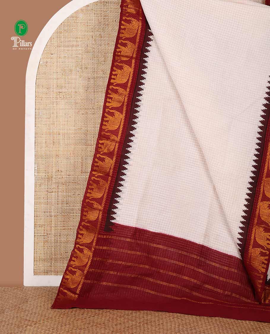 White zari checked sungudi cotton saree, contrast maroon temple & elephant motifs dual-border, striped pallu & contrast checked blouse