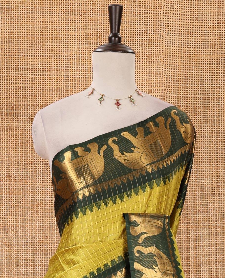 Liril Green checked semi-tafeta saree, contrast temple zari elephant motifs border, striped pallu & matching checked zari border blouse