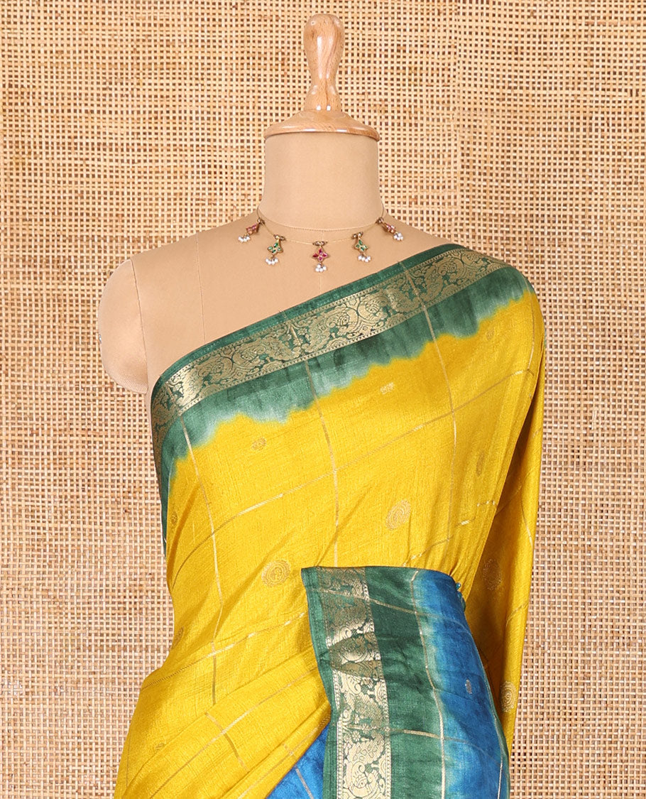 Yellow buttas enclosed checked dola silk saree, contrast shibori print with traditional zari border, buttas enclosed checked pallu, and a contrast buttas enclosed checked blouse