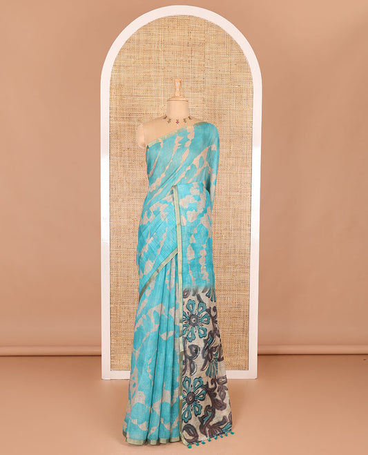 Borderless rama blue batik printed linen cotton saree, hand brush painting style floral vine printed pallu, and contrast floral printed blouse