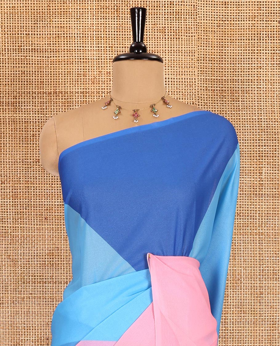 Borderless blue plain moss chiffon saree, contrast double-sided temple border, self-pallu, and diamond-patterned printed blouse