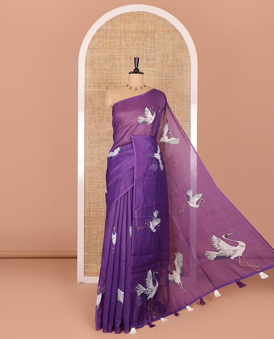 Borderless purple crane motifs printed linen cotton saree, crane motifs printed pallu, and a contrast crane printed blouse