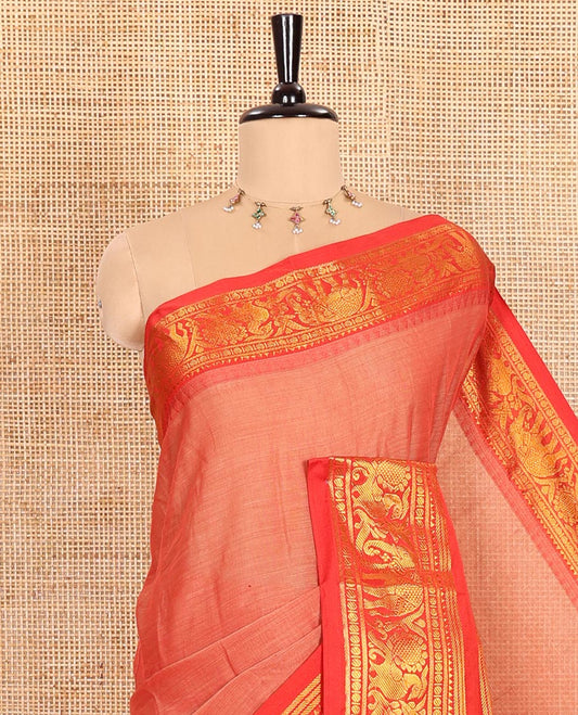 Light Rust Orange Plain Mercerised Cotton Saree Highlighted with a Contrasting Rettai Pettu Border Featuring Peacock and Elephant Motifs in Zari, a Subtly Striped Pallu, and a Matching Blouse