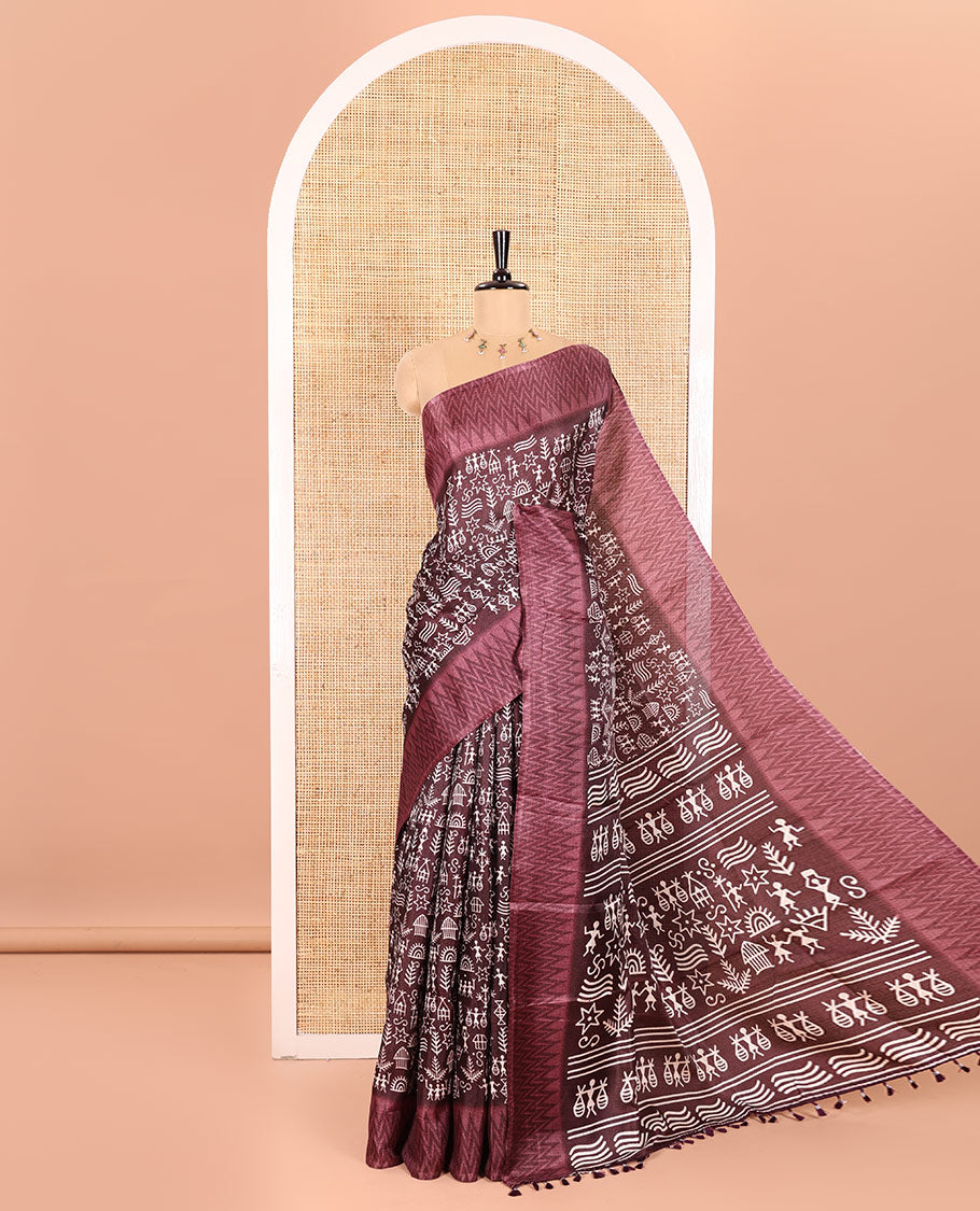 Wine Art Khadi Cotton Saree Highlighted by Warli-Village Theme Print, Complemented with a Contrasting Chevron-Printed Border, Vibrantly Warli-Printed Pallu, and a Plain Blouse